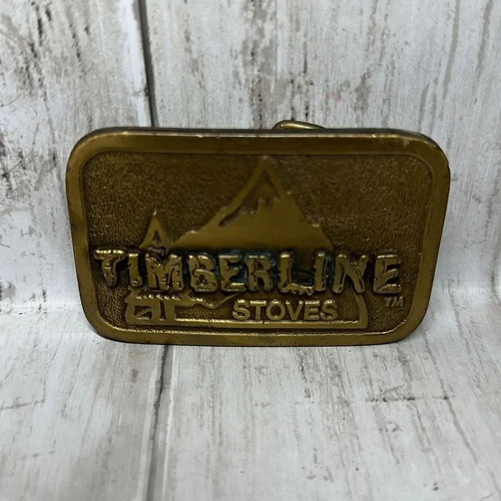 Timberline Stoves Raised Mountain Design Gold Colored Belt Buckle Hit Line USA
